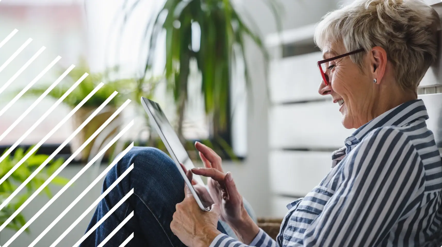 Photo of a woman working on a tablet.